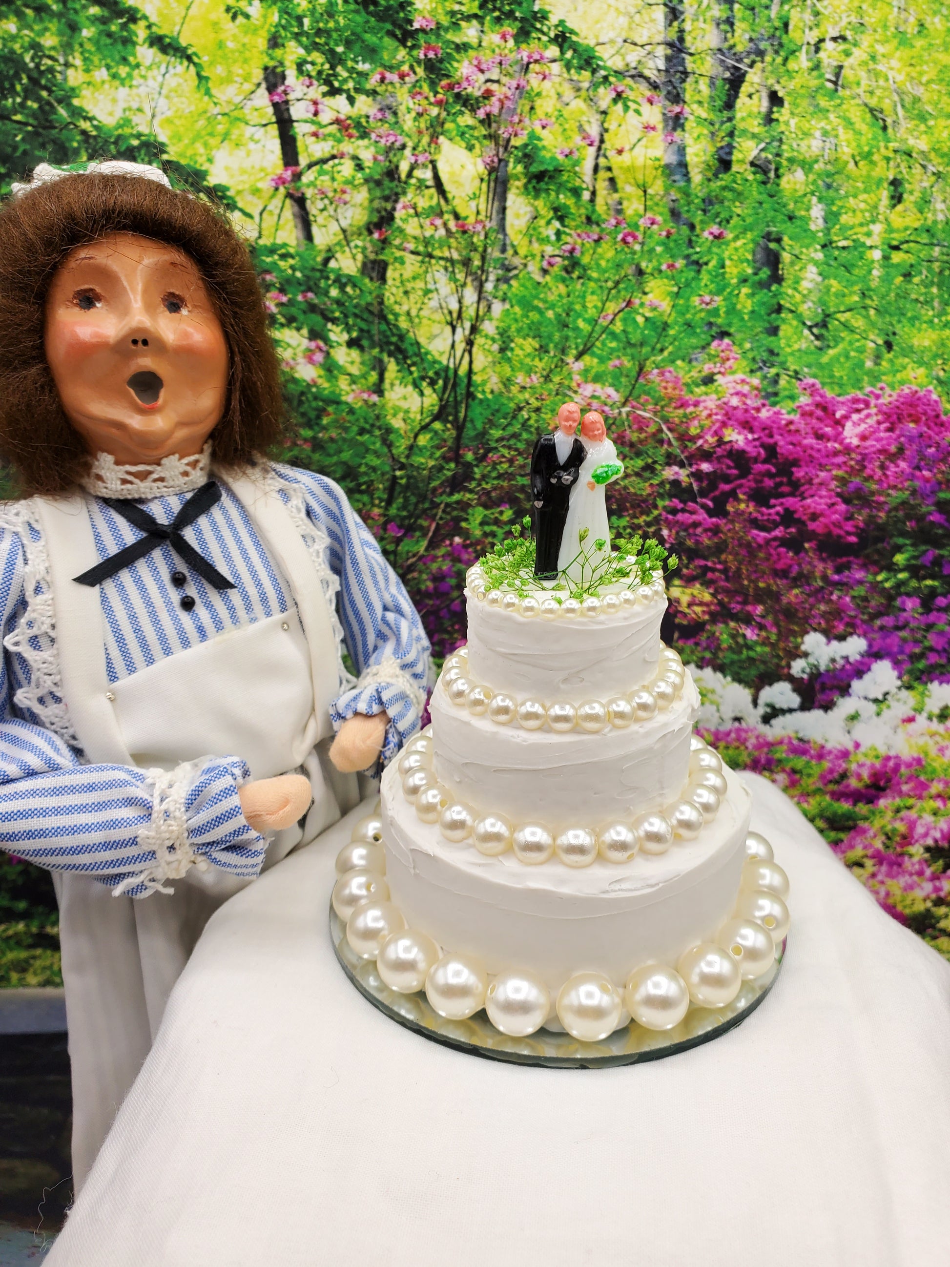 Byers choice doll and wedding cake