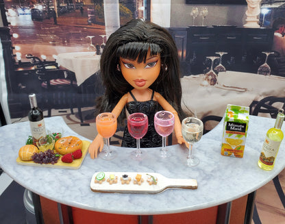 Bratz doll with wine and cheese board