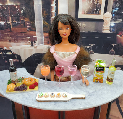 Barbie with wine and cheese board